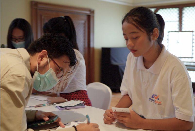 A counsellor helping students with their applications