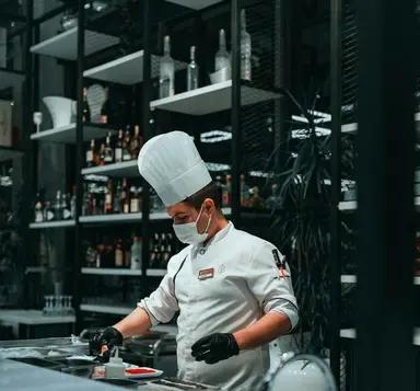 A chef at work in a commercial kitchen
